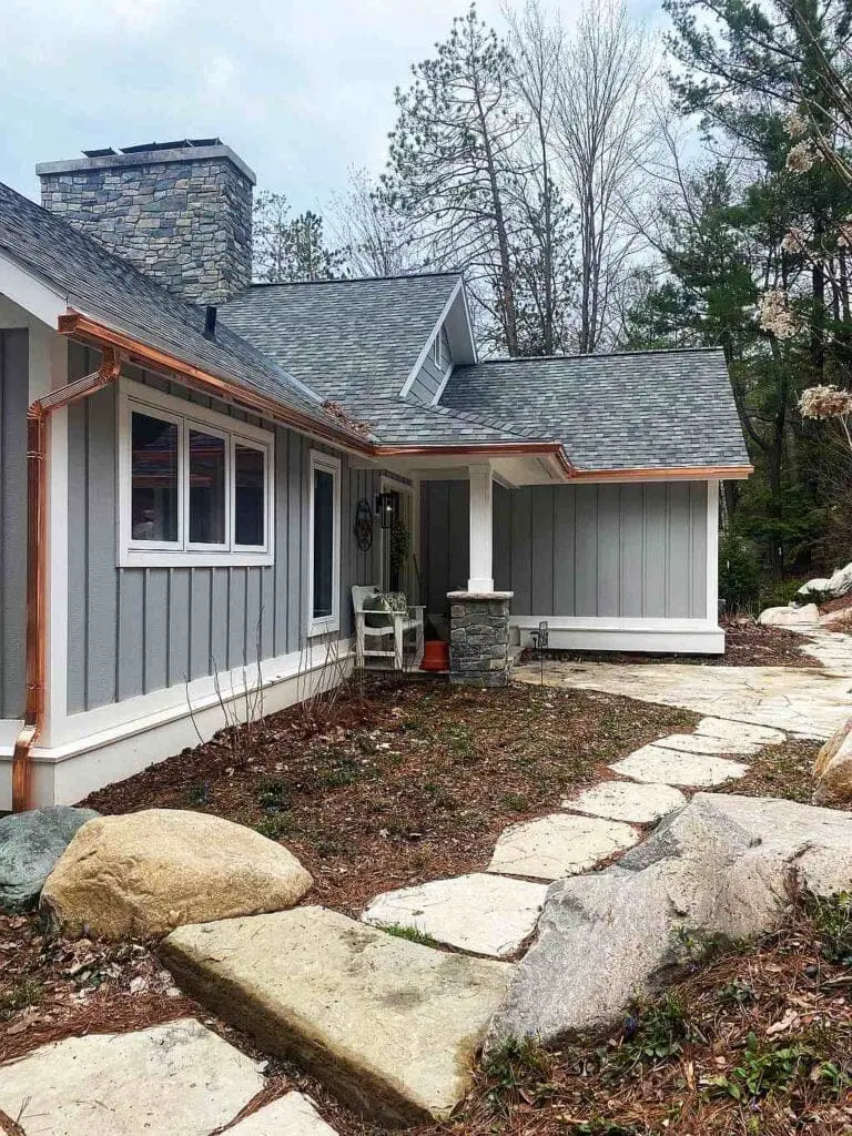 copper gutter gray house