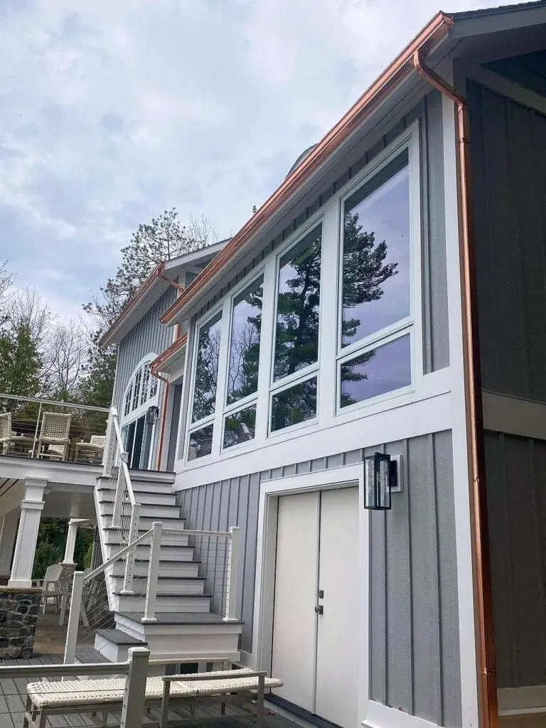 copper gutter gray house